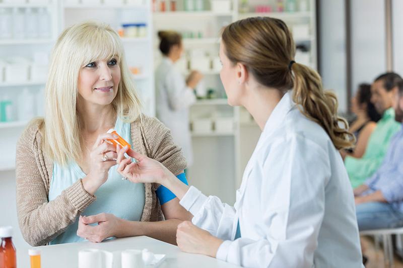 woman talking to pharmacist